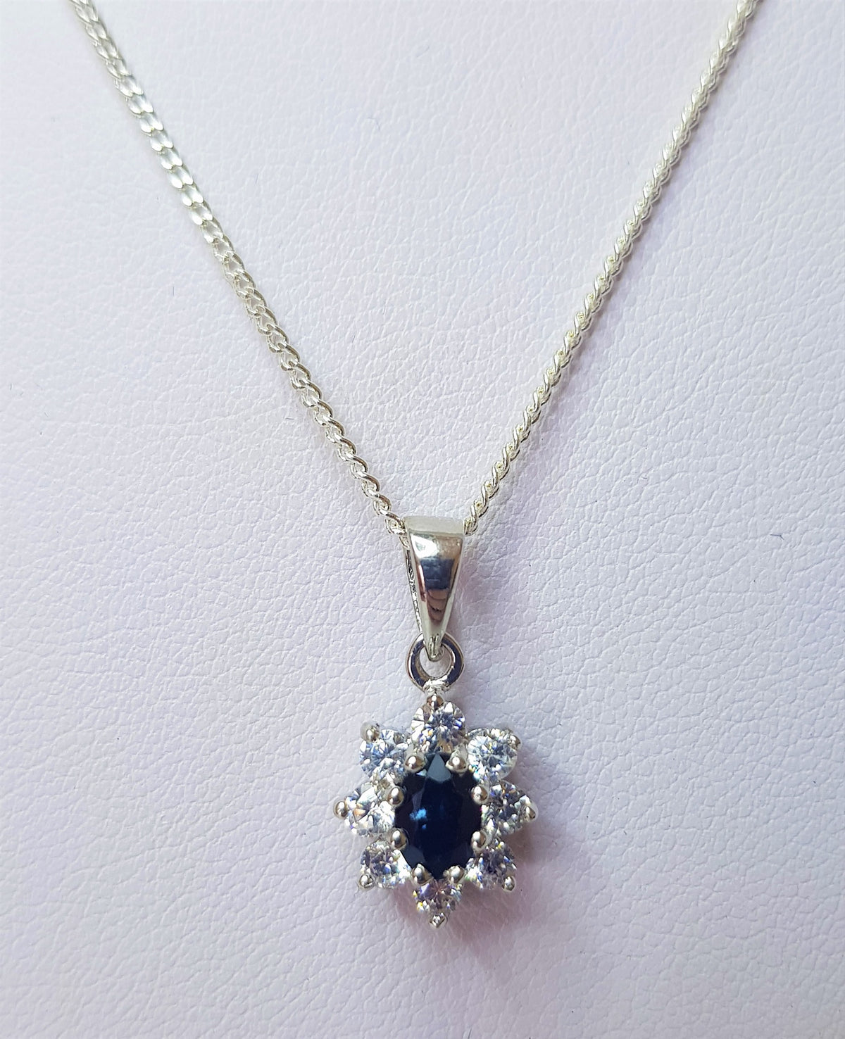 Oval Cut Blue Sapphire and Cubic Zirconia Cluster Pendant