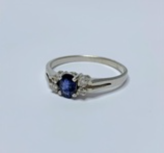 Oval Blue Sapphire and 4 x Cubic Zirconia Sterling Silver Ring