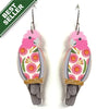 Pair of pink parrot earrings with floral design on a white background