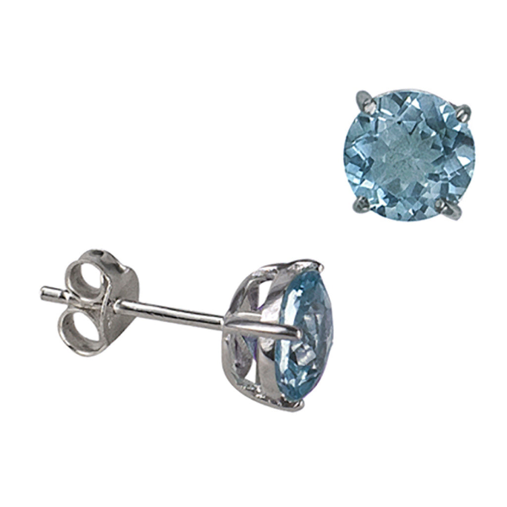 Pair of 7mm round blue topaz claw-set sterling silver stud earrings, shown front-facing and profile view with post and scroll back, on a plain white background