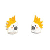 A pair of small enamel pins shaped like cartoon cockatoos with bright yellow spiky feathers, white faces, and black eyes, shown on a plain white background.