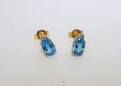 Oval Blue Topaz And Diamond 9ct Yellow Gold Studs