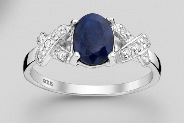 7 x 9mm Oval Sapphire Sterling Silver Ring With Cross Over Band